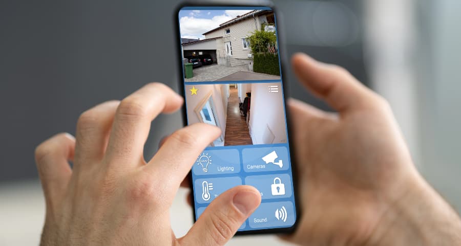 Person checking surveillance camera streams on a cell phone